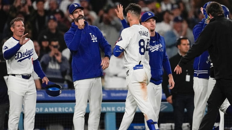 Los Angeles Dodgers' Andy Pages (84) leaves the field after...