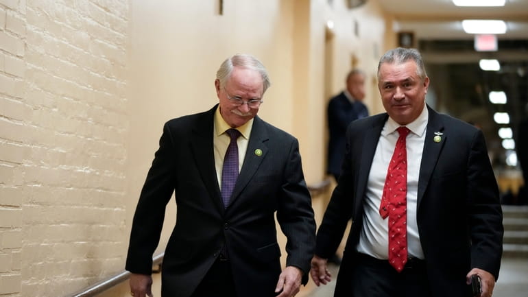 Rep. John Rutherford, R-Fla., left, and Rep. Don Bacon, R-Neb.,...