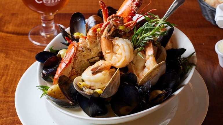 A pan roast of lobster, shrimp, clams, mussels, potatoes and...