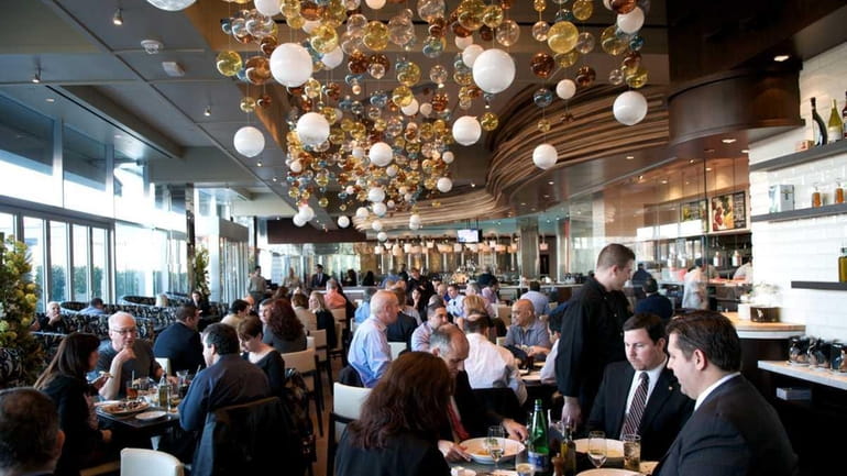 Diners linger over lunch at Jewel, a new restaurant in...