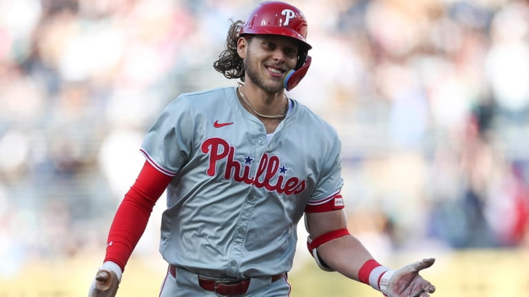 Philadelphia Phillies' Alec Bohm smiles after hitting a two-run home...