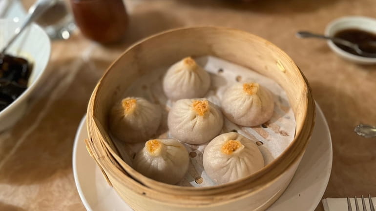 Soup dumplings with crab meat and pork are a must-order...