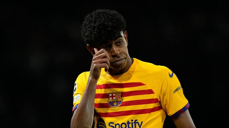 Barcelona's Lamine Yamal gestures during the Champions League quarterfinal first...