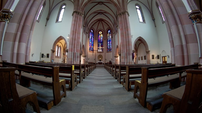 Empty church pews are pictured at the catholic St. Ludwig...