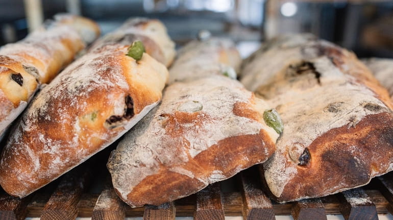Olive ciabatta, a large loaf packed with black and green olives...