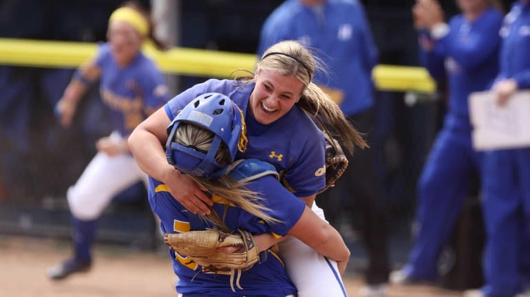 Hofstra's Olivia Galati celebrates with catcher Erin Trippi after defeating...