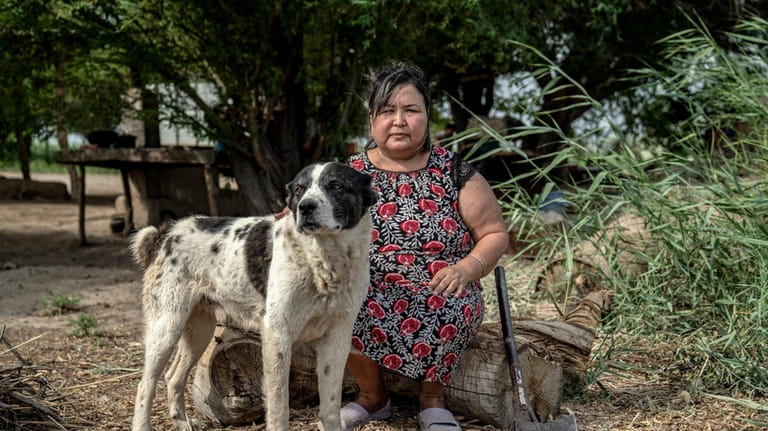 Nafisa Bayniyazova poses for a photo with her dog Alabai,...