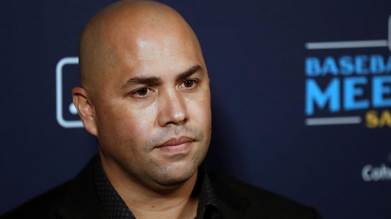 Mets manager Carlos Beltran listens to a question during the...