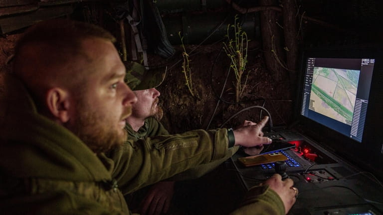 Ukrainian servicemen Anatolii and Dmytro of 148th separate artillery brigade...