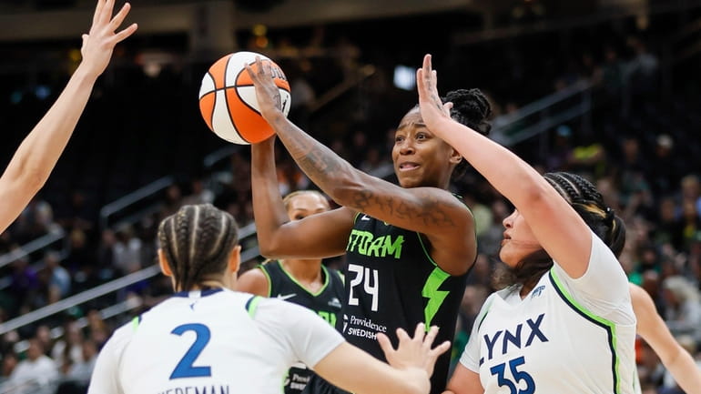 Seattle Storm guard Jewell Loyd passes the ball against the...