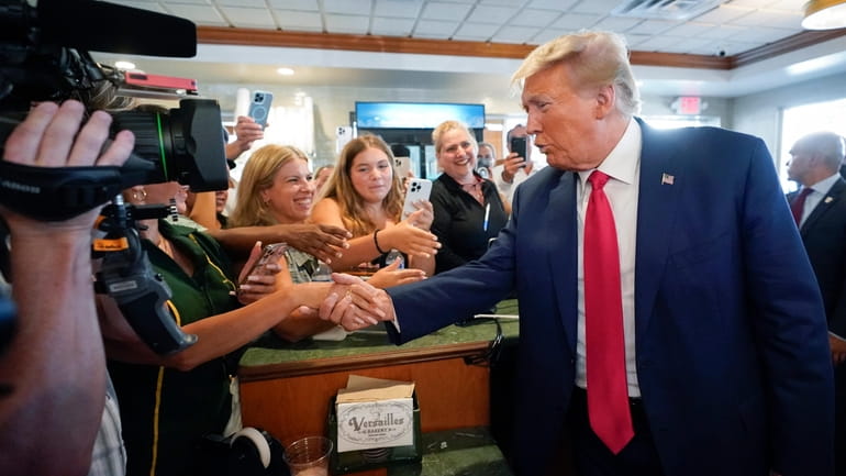 Former President Donald Trump greets supporters at Versailles restaurant on...