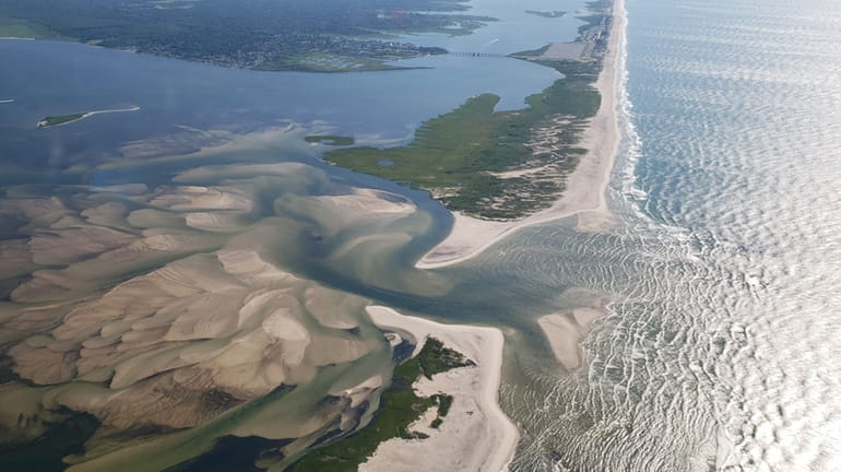 An aerial view of a South Shore inlet at Fire Island,...