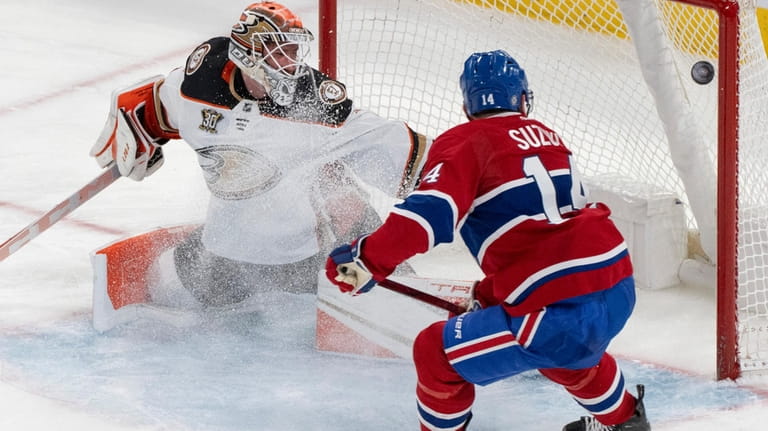 Montreal Canadiens' Nick Suzuki (14) scores on Anaheim Ducks goaltender...