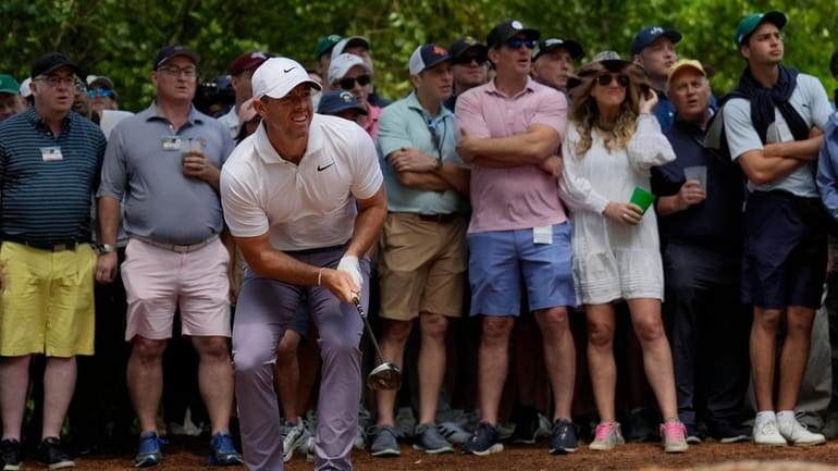 Rory McIlroy, of Northern Ireland, watches his shot from the...