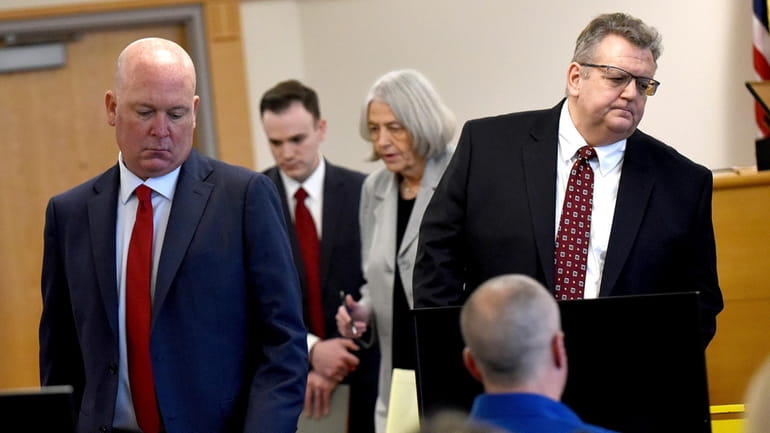 David Meehan sits in court as his attorneys Rus Rilee,...