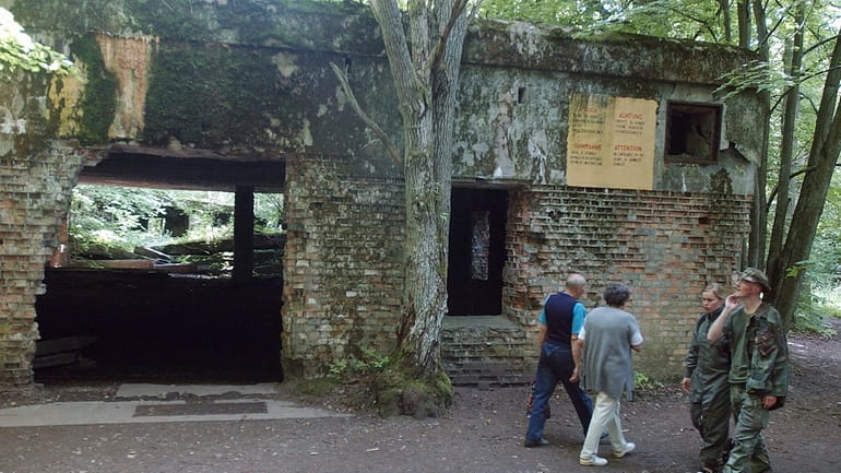 Tourists visit the ruins of Adolf Hitler's headquarters the "Wolf's...