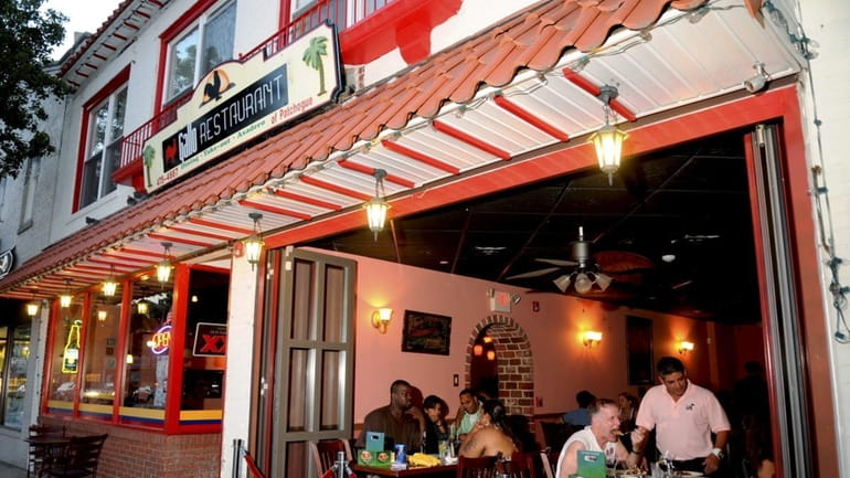 Gallo, a Colombian restaurant in downtown Patchogue, has doors that...