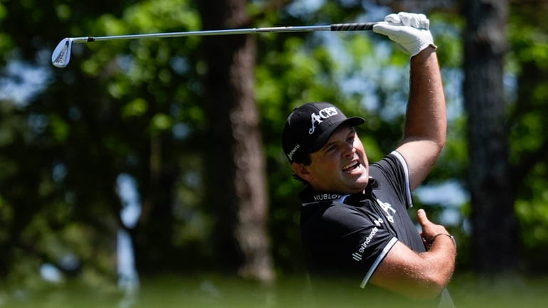 Patrick Reed reacts to his tee shot on the fourth...