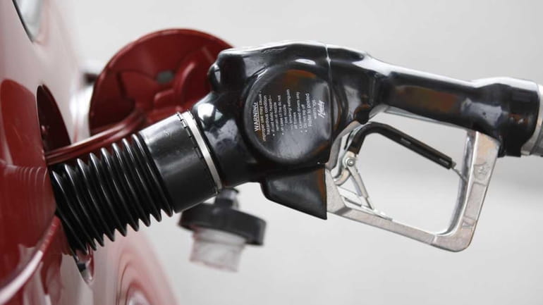 A file photo of a gas pump nozzle in Portland,...