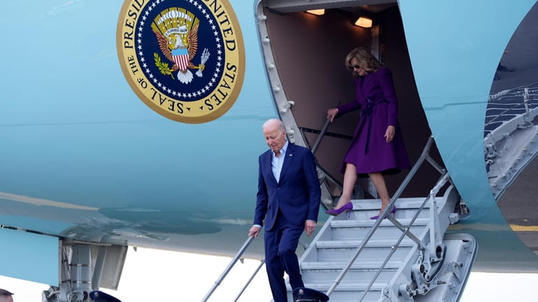 President Joe Biden and first lady Jill Biden arrive at...