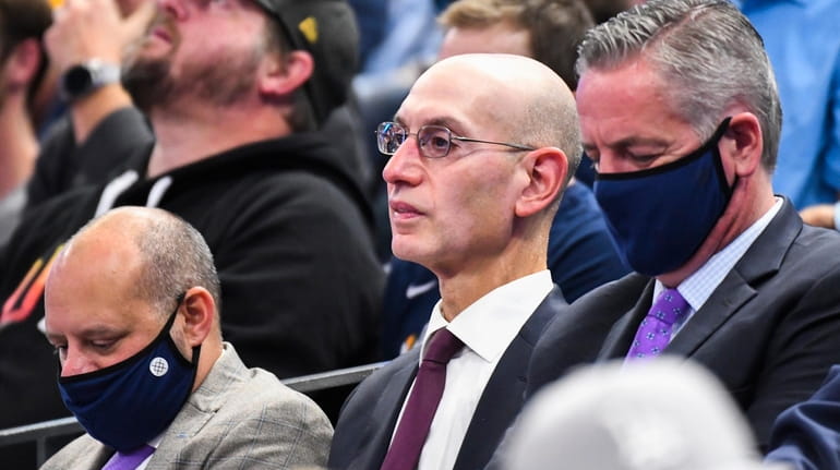 NBA commissioner Adam Silver looks on during a game between...