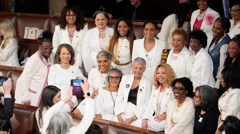 Women members of the House of Representatives, pose for photos...