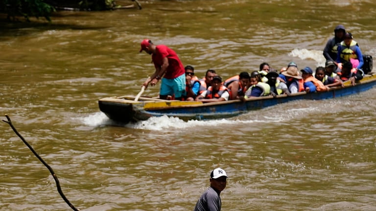 Migrants heading north arrive to Lajas Blancas, Darien province, Panama,...