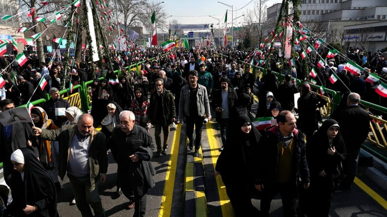 Iranians attend the annual rally commemorating the 1979 Islamic Revolution...