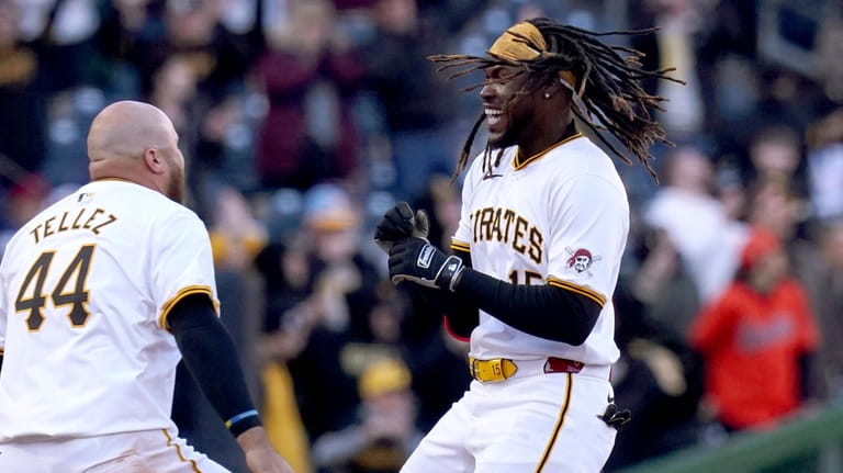 Pittsburgh Pirates' Oneil Cruz, right, celebrates with Rowdy Tellez, left,...