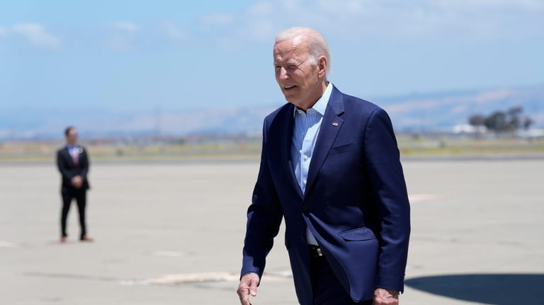 President Joe Biden arrives at Moffett Federal Airfield, Calif., Monday,...