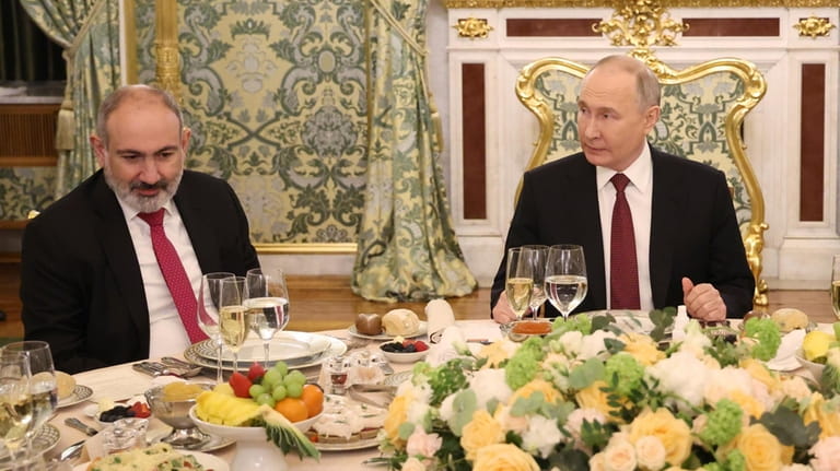 Armenian Prime Minister Nikol Pashinyan, left, and Russian President Vladimir...