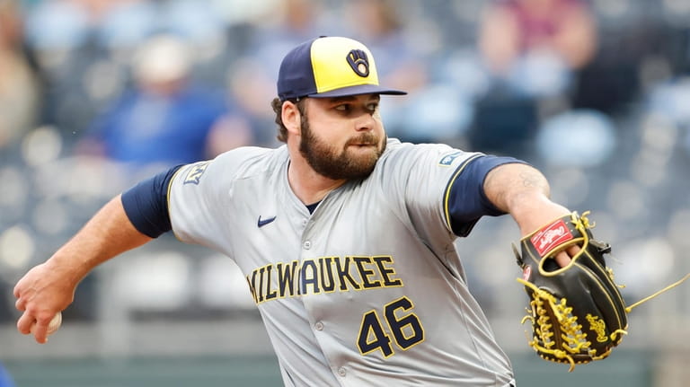 Milwaukee Brewers pitcher Bryse Wilson delivers to a Kansas City...