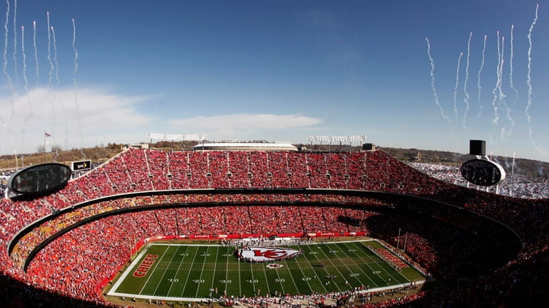 FILE- Fans fill Arrowhead Stadium as fireworks go off before...