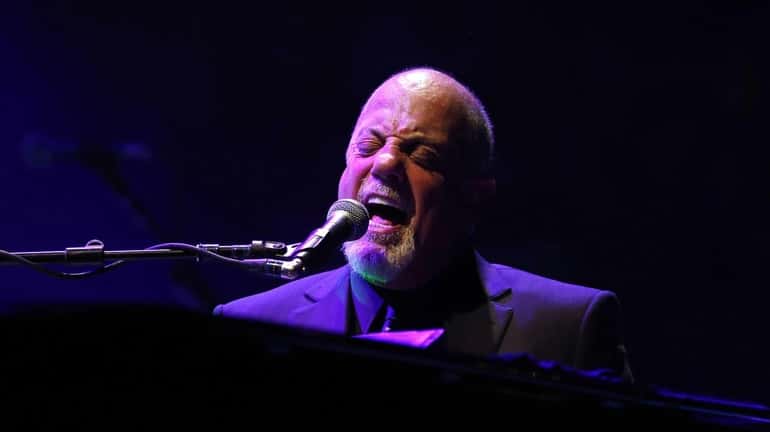Billy Joel takes the stage at Madison Square Garden in...