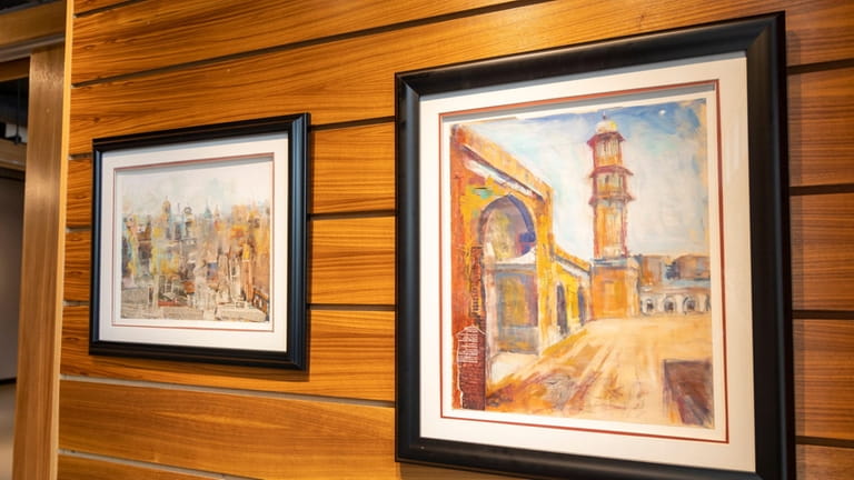 Street scenes and cityscapes are the specialty of Levittown artist...