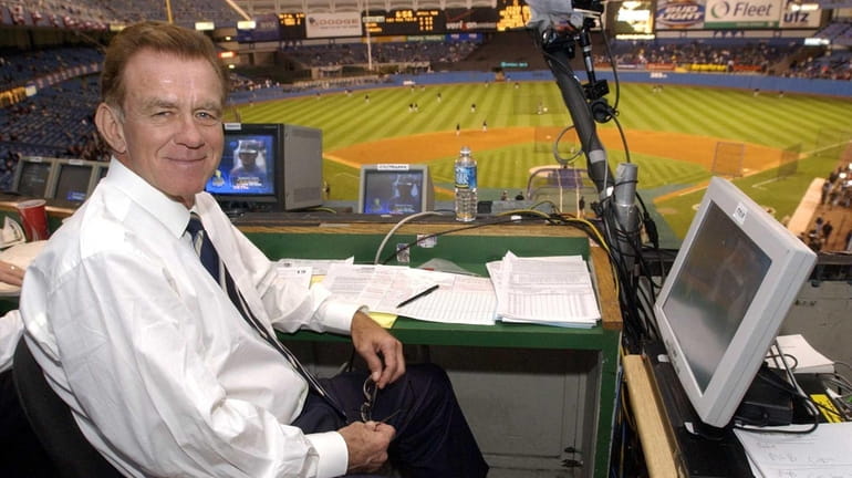 Baseball announcer Tim McCarver poses in the press box before...