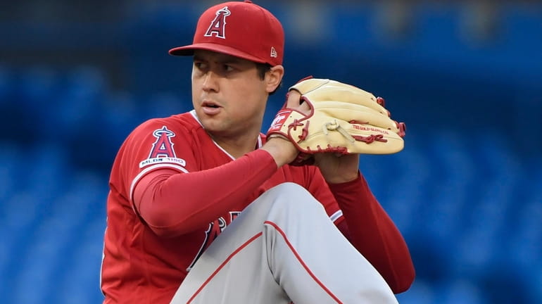Angels starting pitcher Tyler Skaggs winds up during the first...