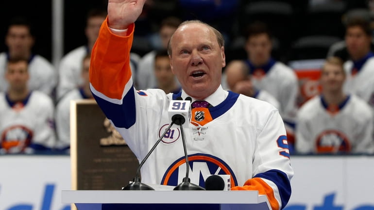 Butch Goring waves to the crowd during his jersey retirement...