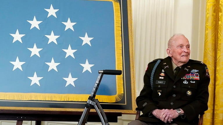 Retired U.S. Army Col. Ralph Puckett listens to President Joe...