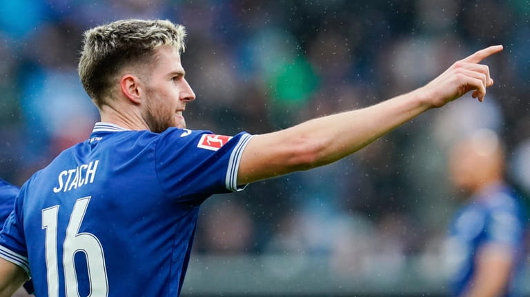 Hoffenheim's Anton Stach celebrates scoring their side's fourth goal of...