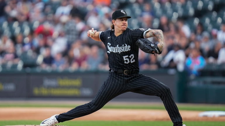 Chicago White Sox starting pitcher Mike Clevinger throws during the...