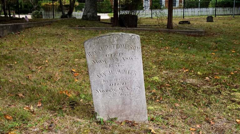 The headstone of the Rev. J.P. Thompson is seen at the...