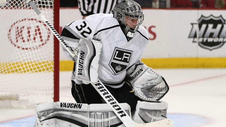 Jonathan Quick of the Los Angeles Kings makes a save...