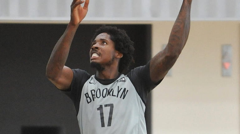 Ed Davis #17 of the Brooklyn Nets works on his...