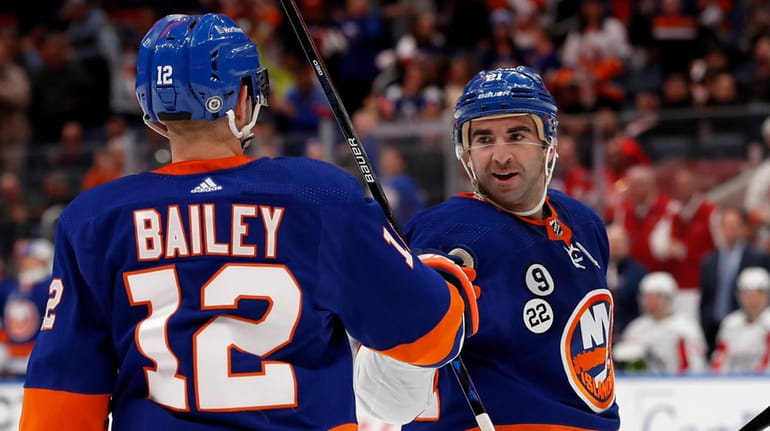 Kyle Palmieri #21 of the New York Islanders celebrates his...