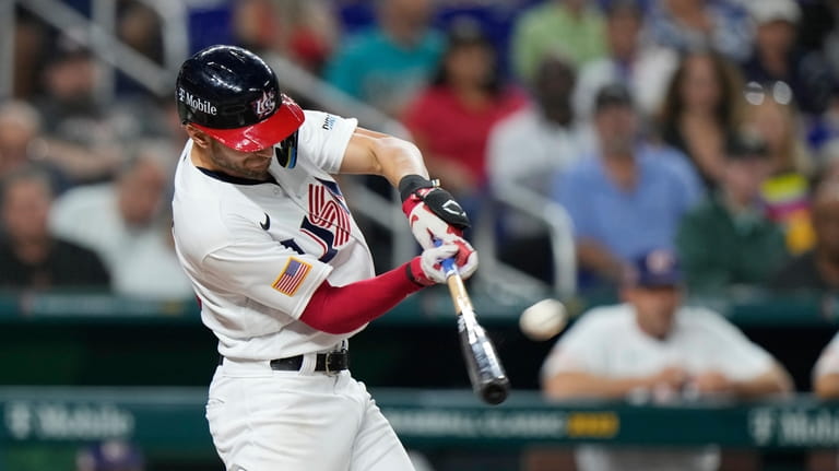 United States' Trea Turner hits a home run during the...