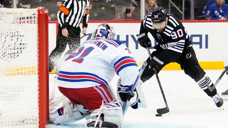 New York Rangers goaltender Igor Shesterkin (31) protects his net...