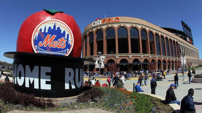 Citi Field and the home run apple are seen before...