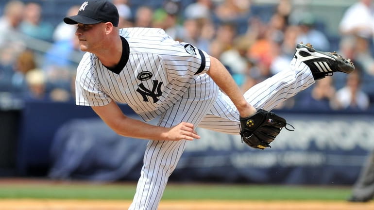 New York Yankees relief pitcher Chad Gaudin (41) throws during...