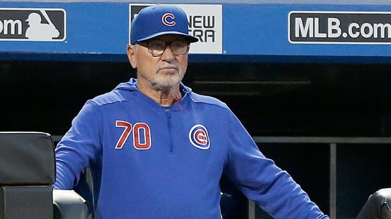 Manager Joe Maddon #70 of the Chicago Cubs looks on...
